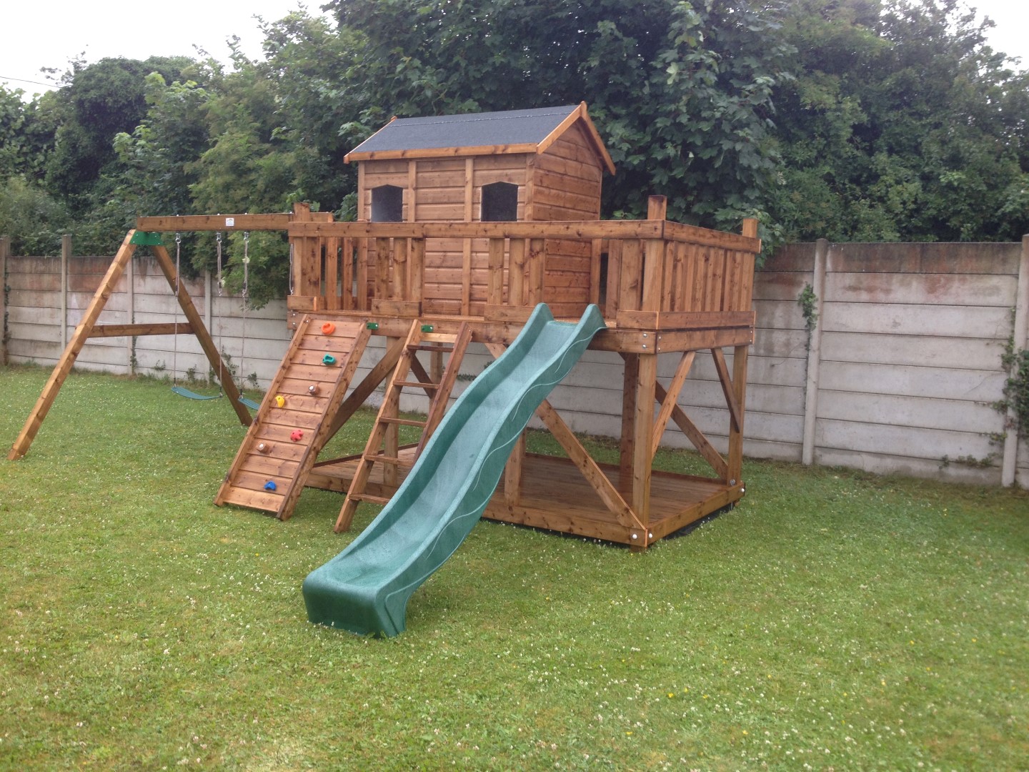Tree house Adam Three house playhouse terrace swings slide rock wall access ladder