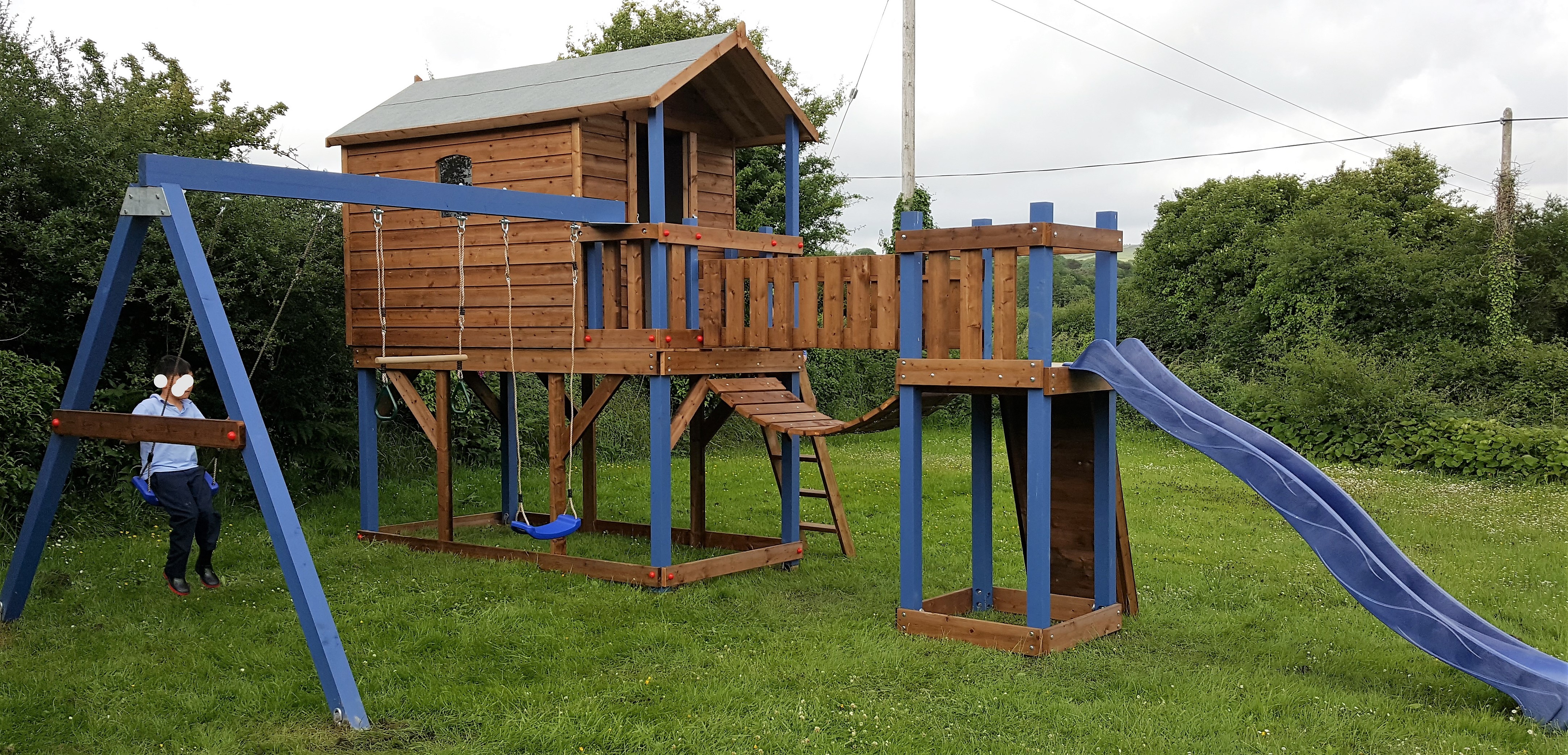 Tree house slide climbing wall swings ladder chain bridge