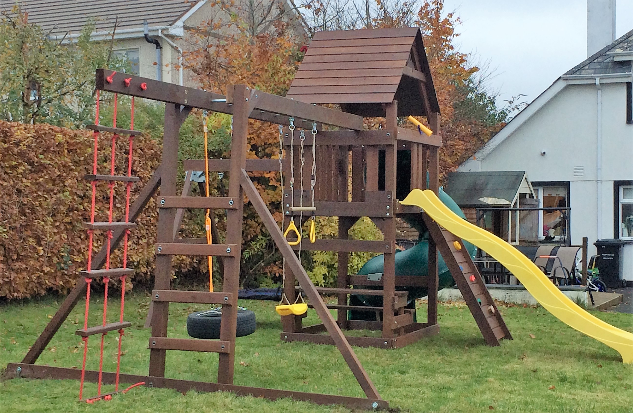 Climbing frame spiral tube slide monkey bars nest swing