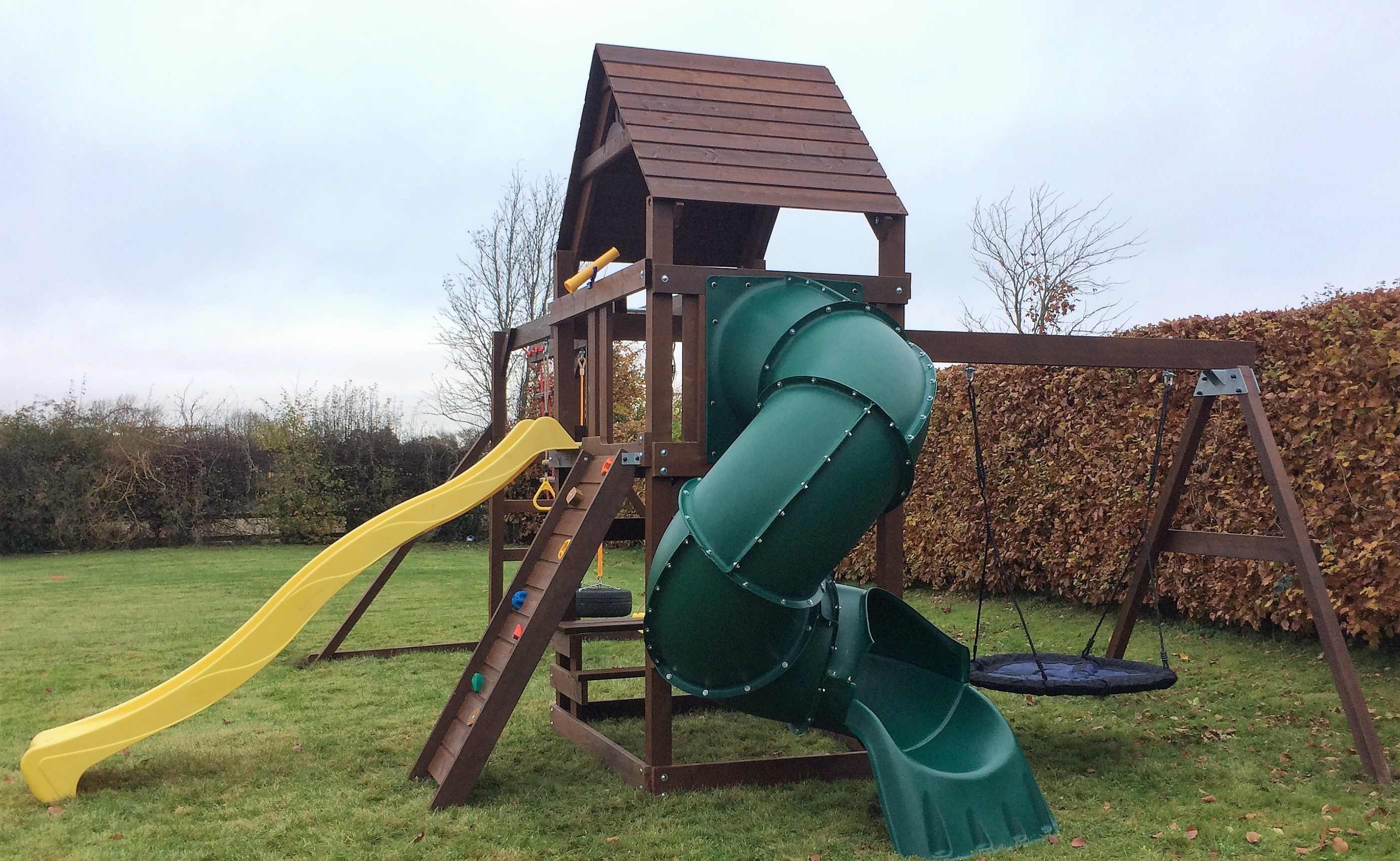 Climbing frame spiral tube slide monkey bars nest swing